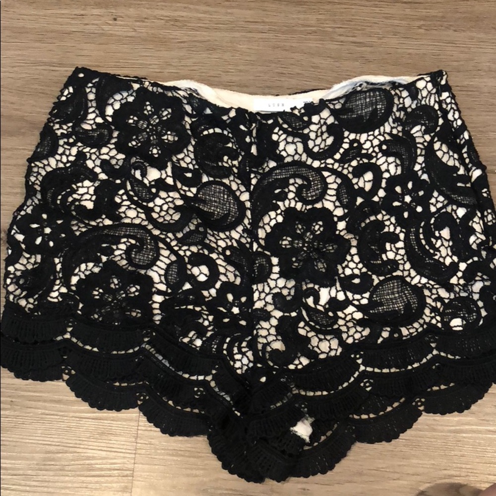 Black lace shorts with pink undertone